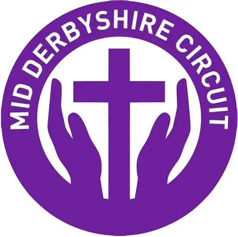 Purple circular logo with 'MID DERBYSHIRE CIRCUIT' text around the edge and a central cross between two cupped hands.